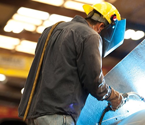 Welder wearing the Jackson Safety Jackson 15134 W10 HSL 100 Black Passive Welding Helmet while working on a metal surface, emphasizing safety and protection in action.