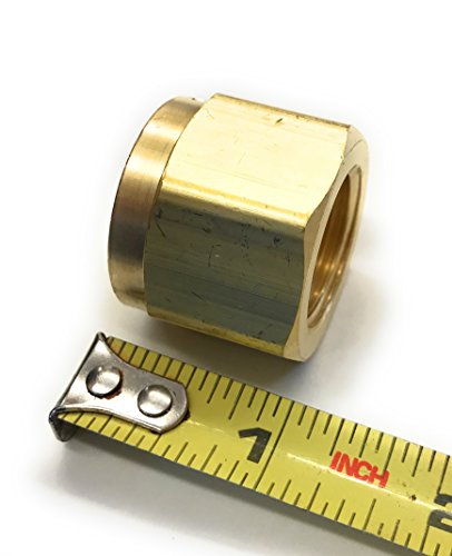 CGA-300 Hex Nut for Acetylene Gas Service by Western Enterprises, displayed next to a measuring tape for size reference, highlighting its solid brass construction.